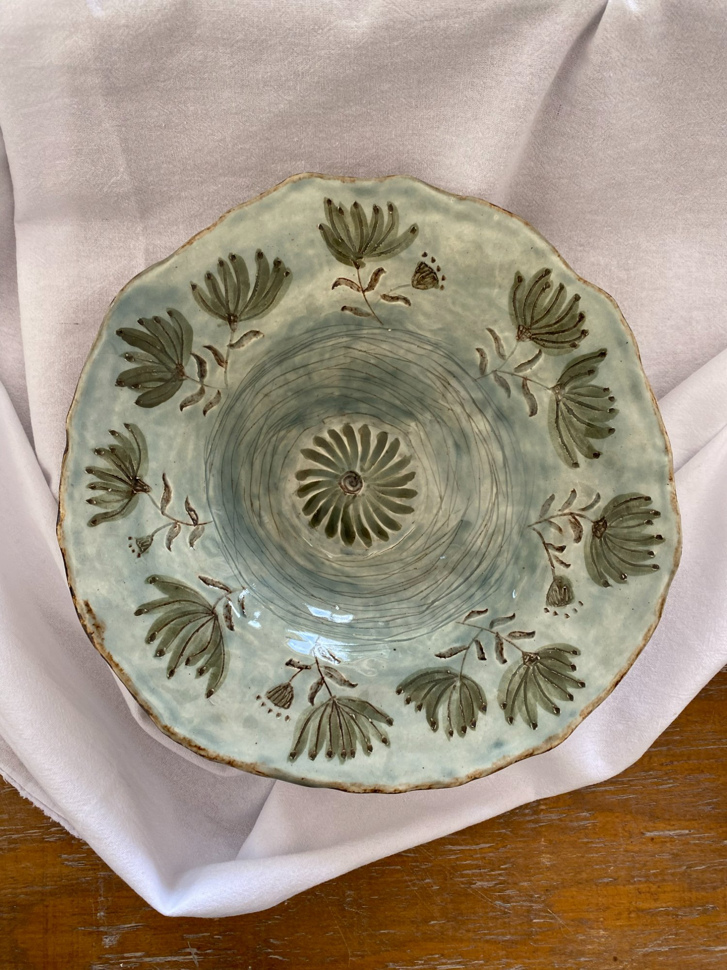 Textured dish in soft earthy greens