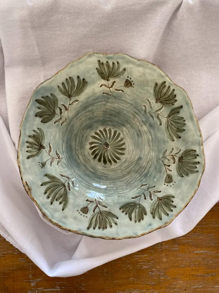 Textured dish in soft earthy greens